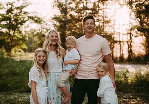 We offer ethical and comprehensive dentistry in Boise ID Dr. Minert in casual clothes with his family