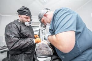 dentists probing mouth